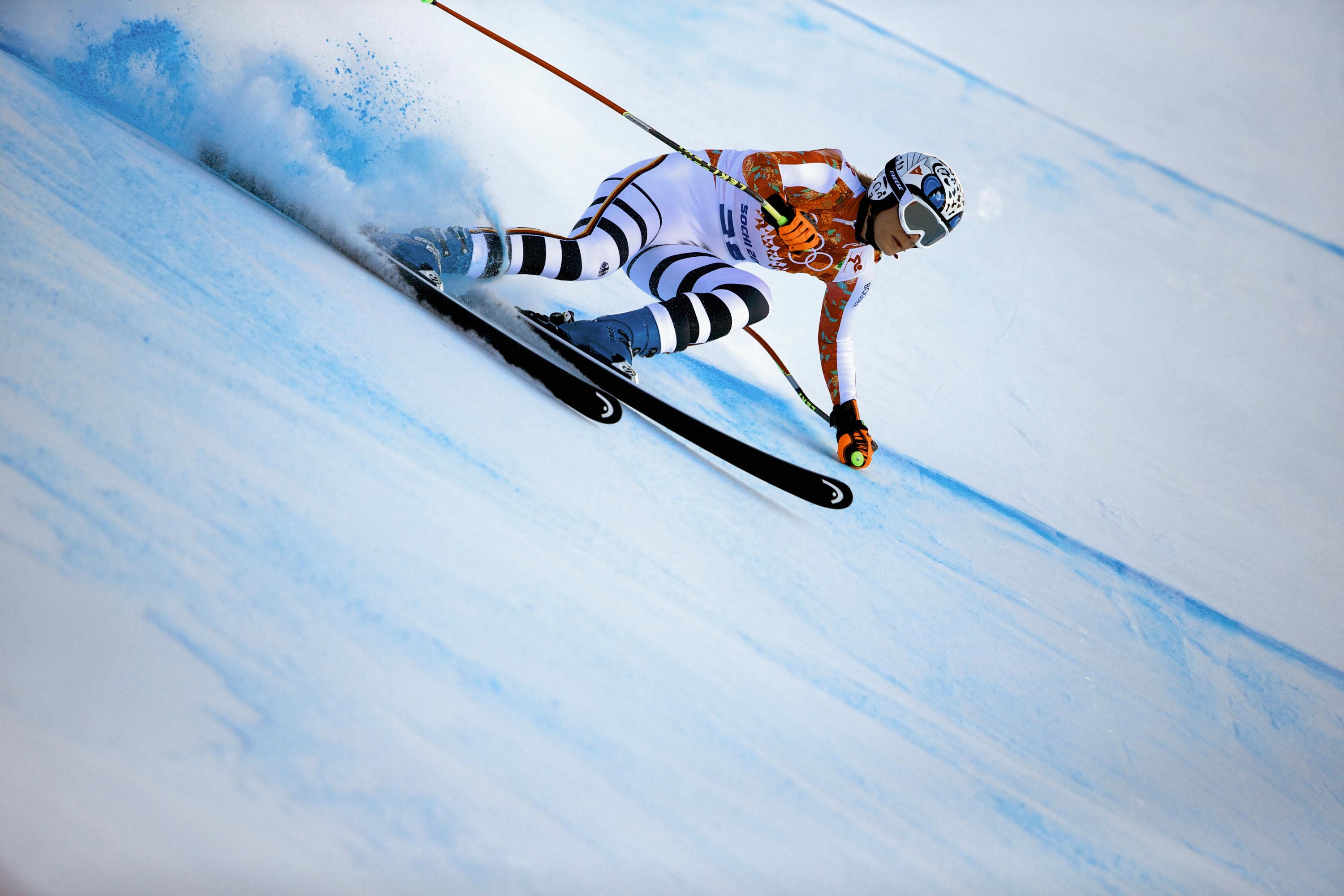 Alpine skier in a competiton doing downhill